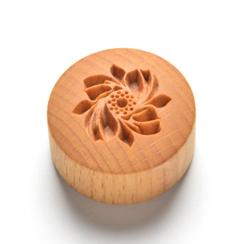 curve top whirling flower pottery stamp
