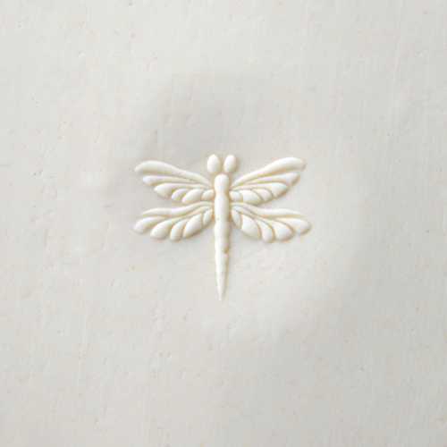 curve top dragonfly stamp